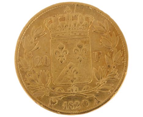 A French 1820 Louis XVIII gold twenty francs coin, 21mm, 6.3gHigh points quite heavily worn, light abrasions all over 