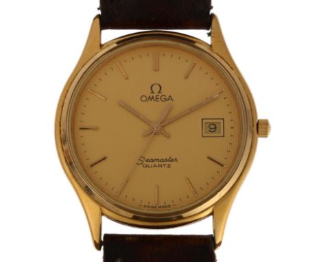 OMEGA - a gold plated stainless steel Seamaster quartz calendar wristwatch, ref. 1430, champagne dial with applied gilt baton