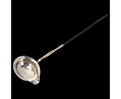 A Georgian silver whale bone toddy ladle, 34cmBowl has a few light dents and original engraved initials FMM, unmarked 