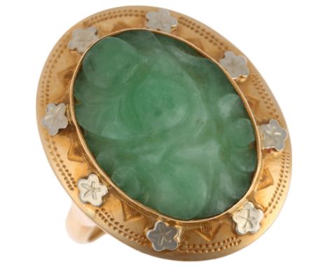 A 14ct gold jade panel ring, setting height 22mm, size O, 4.8gNo damage or repair, light wear to high points, mark clear, sta