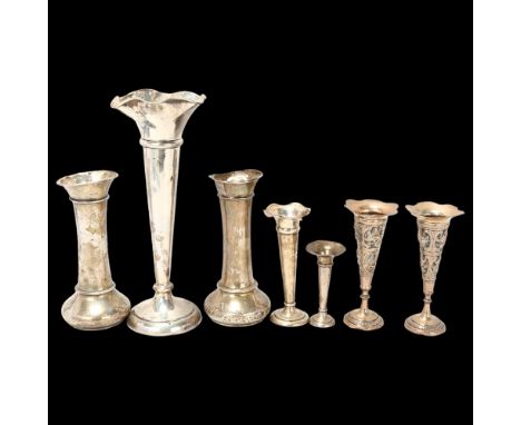 7 silver bud vases, including Indian pair, largest 24cm, loaded basesLot sold as seen unless specific item(s) requested 