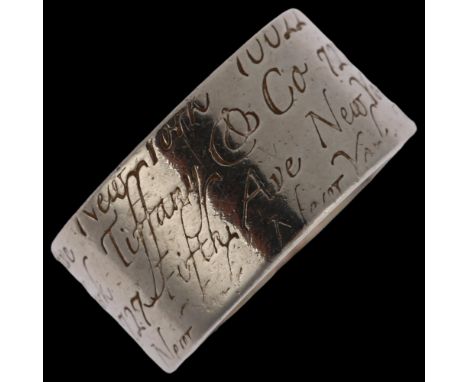 TIFFANY & CO - a sterling silver Notes Fifth Avenue band ring, band width 9.9mm, size L/M, 8gNo damage or repair, only light 