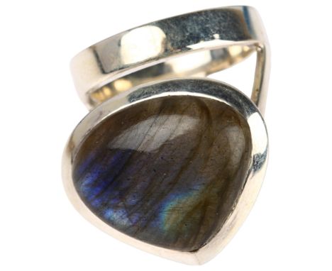A modernist sterling silver labradorite ring, set with pear cabochon labradorite, setting height 27.9mm, size R/S, 16.3gNo da