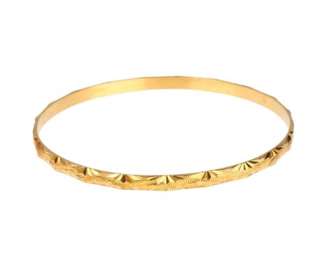 A Middle Eastern high carat gold slave bangle, band width 4mm, internal circumference 20cm, 15.4gNo damage or repair, only ge