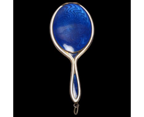 An Art Deco Continental silver-gilt blue and white enamel novelty hand mirror compact, 7.5cmA few small enamel surface chips 