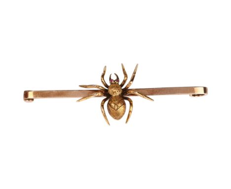 An Edwardian ruby figural spider bar brooch, circa 1910, unmarked gold set en tremblant with realistically modelled spider ha