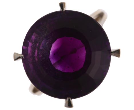 An 18ct white gold solitaire amethyst ring, claw set with 15ct round step-cut amethyst, amethyst weight calculated from dimen