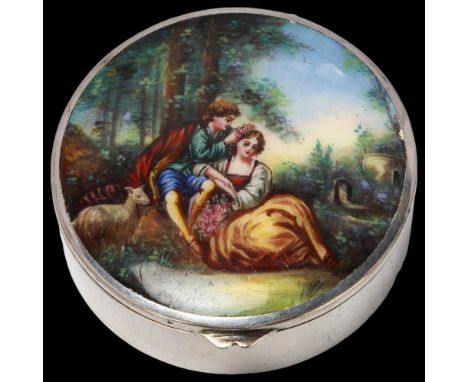 A Continental silver plate alpacca and enamel dressing table compact, cylindrical form, with hand painted lover scene lid and