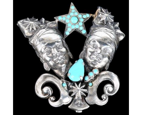 An Egyptian turquoise glass figural brooch, unmarked white metal settings with female head and star motif, height 56mm, 12.6g