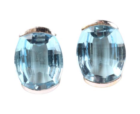 A pair of 18ct white gold blue topaz earrings, set with oval barrel-cut topaz with stud fittings, 12.7mm, 5.4gNo damage or re