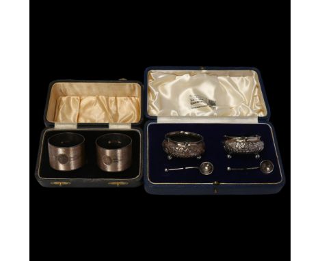 A cased pair of silver napkin rings, and a cased pair of silver salt cellars, 3.3oz totalLot sold as seen unless specific ite