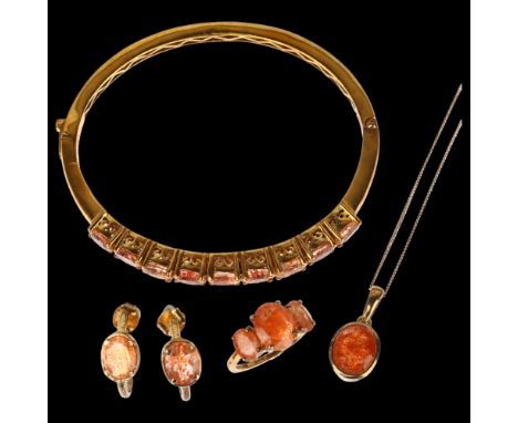 A modern sterling silver-gilt Oregon sunstone demi-parure, comprising ring, pendant necklace, hinged bangle and pair of earri