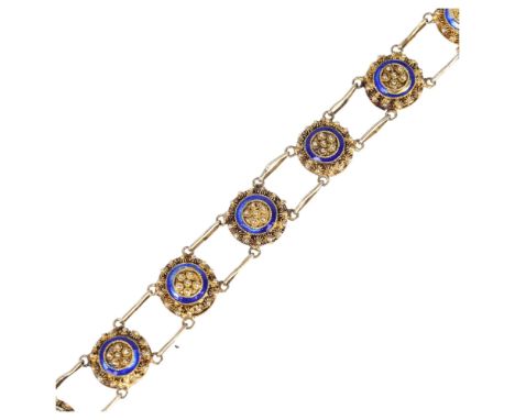 A Portuguese silver-gilt blue enamel panel bracelet, with cannetille decoration and double links, marked 833, with later 9ct 