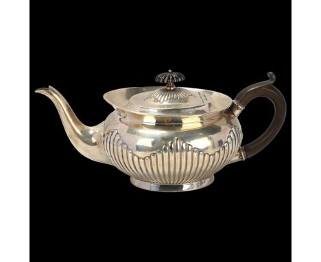 An Edwardian silver teapot, William Hutton & Sons Ltd, London 1904, oval form, with relief embossed half fluted decoration an