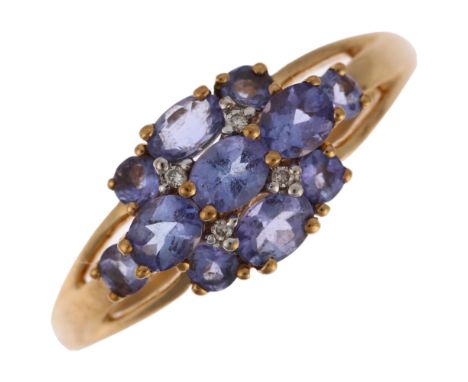 A modern 9ct gold tanzanite and diamond cluster ring, setting height 9.3mm, size V, 2.9gNo damage or repair, all stones prese