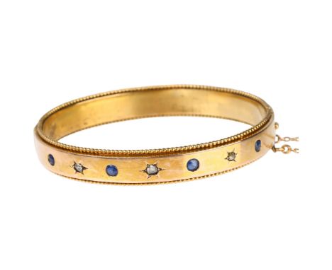 A French gold sapphire and diamond hinged bangle, maker AR, star set with rose-cut diamonds and round-cut sapphires, band wid