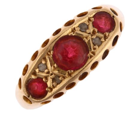 An early 20th century 18ct gold seven stone garnet and diamond half hoop ring, maker HS, Birmingham 1915, setting height 7.1m