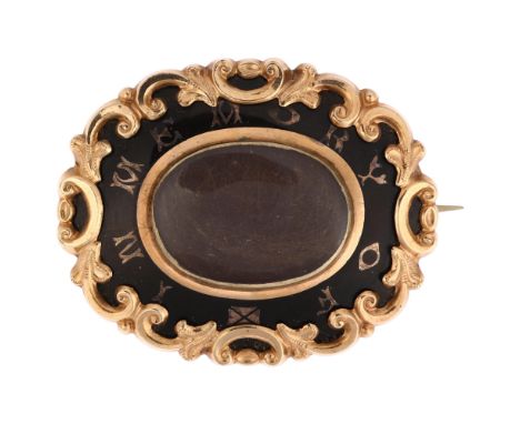 A Victorian black enamel "in memory of" mourning brooch, unmarked yellow metal closed-back settings with foliate surround, 44