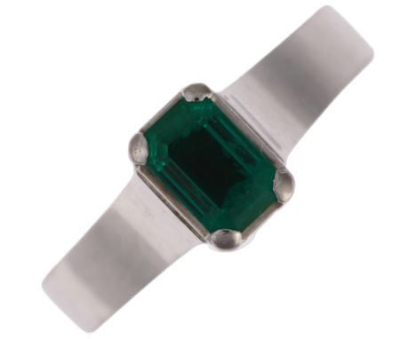 An 18ct white gold solitaire emerald ring, maker BEV, palladium-topped, claw set with 0.5ct octagonal step-cut emerald, emera