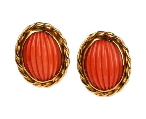 A pair of late 20th century 18ct gold coral earrings, maker's mark SUE, London 1980, set with rib-cut oval cabochon coral wit