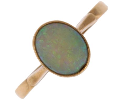 A late 20th century solitaire opal ring, unmarked gold settings with rub-over set oval cabochon opal, setting height 8.9mm, s