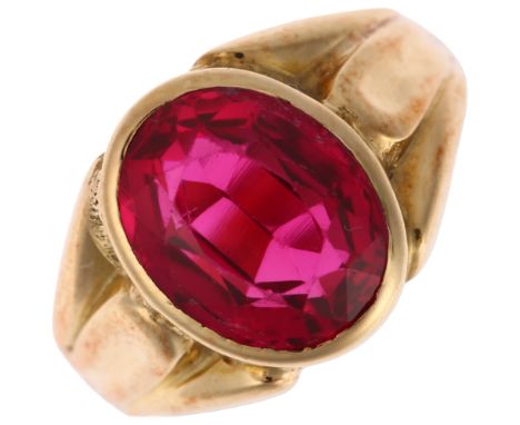 A synthetic ruby signet ring, unmarked gold settings, rub-over set with oval mixed-cut synthetic ruby measuring approx: 11.4 