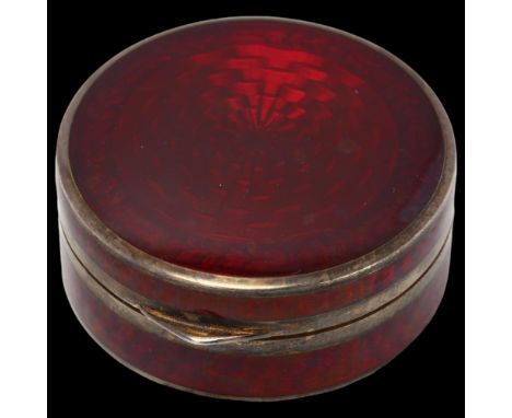 An Art Deco silver and red enamel compact, Cohen & Charles, import London 1926, allover engine turned guilloche decoration wi