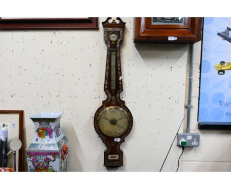 19th century wheel barometer with mother of pearl inlay, dry / damp indicator, 8" main dial, bone finial, plaque marked P Bia