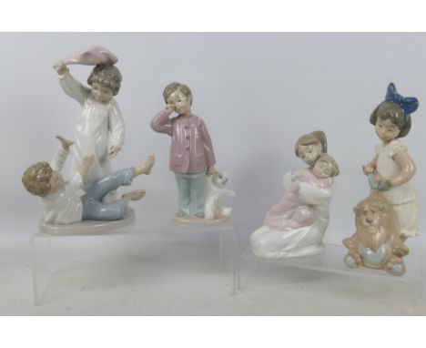 Nao - Four figures / groups to include a girl with a toy lion, pillow fight, boy with a teddy bear and other, largest approxi