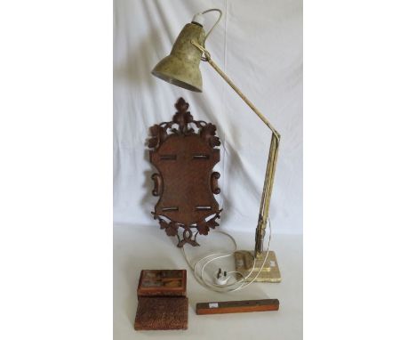 An electric desk lamp , a wooden plaque , spirit level and a carved box of spices