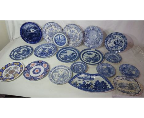 A large collection of mostly early 19th century blue and white pearlware plates and dishes , to include Spode , Minton , Mand