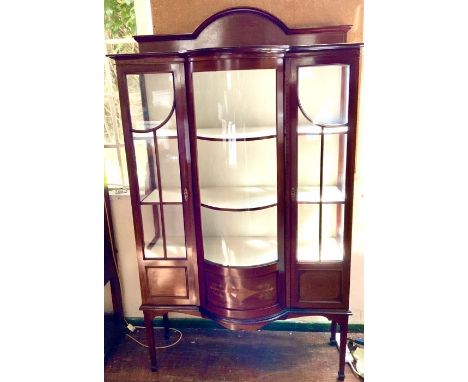 An Edwardian mahogany and satinwood display cabinet, circa 1905, moulded bow top quarter gallery on a bow front display cabin