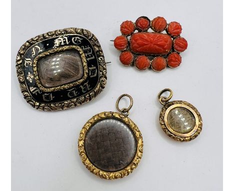 A selection of four pieces of antique mourning jewellery comprising a black enamel brooch, assessed as gold with a hairwork p