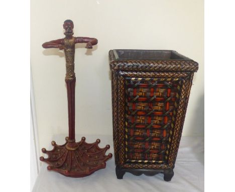  an African  cold painted stick stand and oriental wicker stick basket (2) figure stands 54cm high