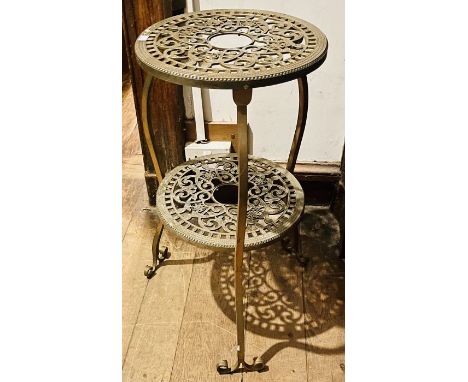 A 20th century gilt lamp stand, two circular tiers in a fleur-de-lys style, raised on triform scrolling cabriole supports. 77