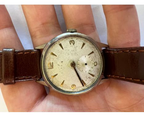 A Rolex Tudor Stainless steel cased watch with silvered dial with engine turned pattern and Arabic numerals/batons. Chronogra