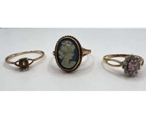 A trio of 9ct gold rings - one a blue cameo (size S); one set with a pink stone (size L) and a blue stone set ring (size P 1/
