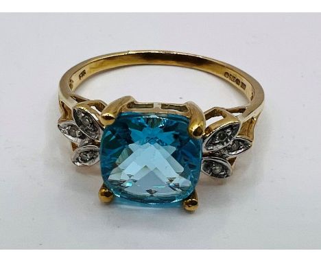 A chequerboard cut, square Swiss Blue topaz ring in 9ct yellow gold. Size o. Approx gross weight 3.1 grams. (1)