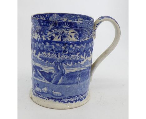 An early 19th century Swansea Cambrian pottery pearlware mug , with  cabbage leaf moulding and decorated with a blue transfer