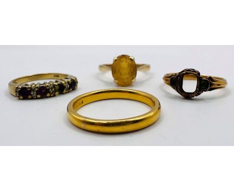 A collection of four gold rings comprising: A 22 ct yellow gold band, approximate weight 4.4 grams, size Q; a citrine set 9ct