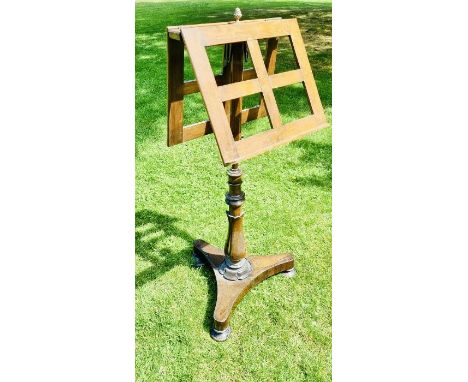 A William IV mahogany duet music stand, circa 1830, mounted with a brass acorn finial, on an&nbsp;opposing lyre-form hinged a