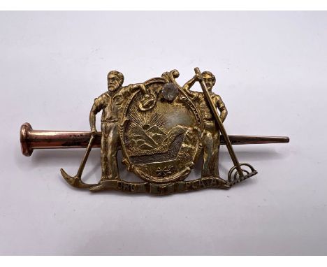 A 19th century State of Montana "Last Nail" World's fair brooch, inscribed with "Oro y plata" - "gold and silver", featuring 
