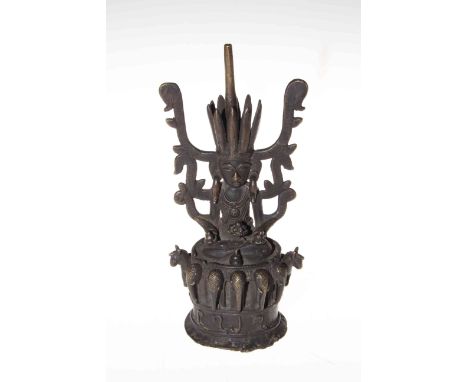 Oriental bronze Buddha figure with elephant heads base, 24cm.
