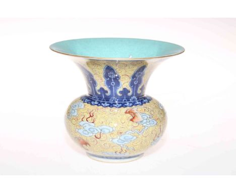 Chinese vase of squat form with flared neck, cloud decoration on swirl yellow ground, blue Quanlong mark to base, 12cm.