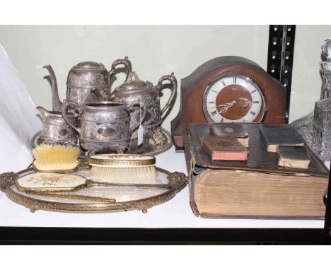Silver plated teapots, jug and server, mantel clock, bibles and a tapestry vanity set.