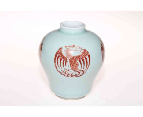 Chinese baluster vase decorated with four iron red phoenix motifs on pale blue ground, six character mark to base, 13cm.