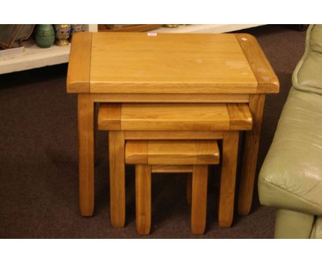 Light oak nest of three tables.