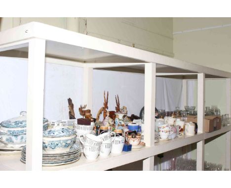 Full shelf of china and glass including dinner and teaware, figurines, commemorative ware, costume jewellery, cameras, etc.