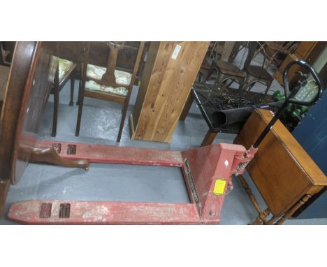 A vintage Clark Strong Arm 2000k trolley jack and a Victorian R Turner of Reading floor standing sack weight scales, together