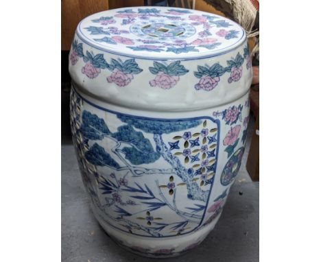 A vintage Chinese porcelain garden seat, the pierced body decorated in a floral design, 47cm h x 32cm wLocation: GIf there is